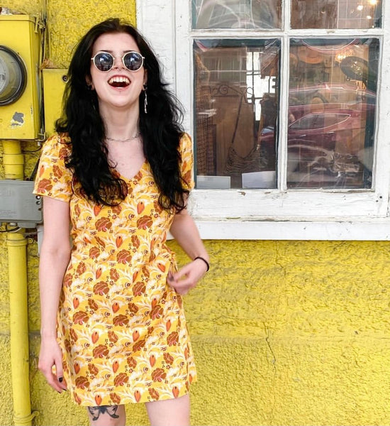 Colourful eco-friendly dresses and jumpsuits hanging in the boutique